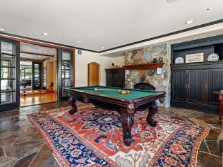 Step into luxury with this stunning property featuring a dedicated game room.