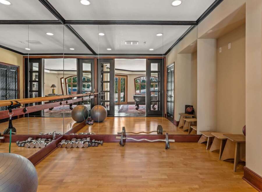 This luxurious home gym offers a serene space for fitness enthusiasts.