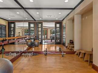 This luxurious home gym offers a serene space for fitness enthusiasts.