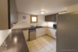 This charming kitchen boasts modern appliances and ample counter space, perfect for preparing delicious meals.