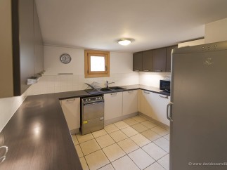 This charming kitchen boasts modern appliances and ample counter space, perfect for preparing delicious meals.
