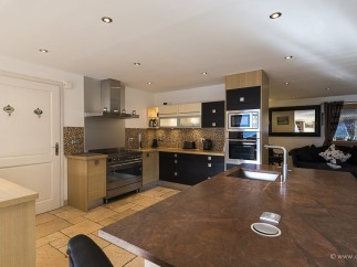 This stunning kitchen boasts modern appliances and ample counter space, perfect for culinary enthusiasts.