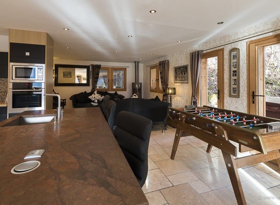 This stunning chalet boasts a spacious open-plan kitchen and living area, perfect for entertaining guests.