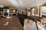 This stunning chalet boasts a spacious open-plan kitchen and living area, perfect for entertaining guests.