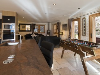 This stunning chalet boasts a spacious open-plan kitchen and living area, perfect for entertaining guests.
