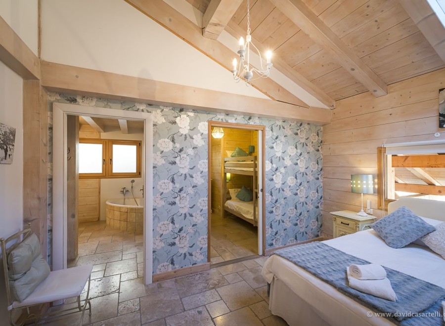 Charming bedroom with ensuite bathroom and bunk beds, perfect for families.