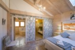 Charming bedroom with ensuite bathroom and bunk beds, perfect for families.