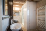 This luxurious bathroom boasts a double vanity with sleek sinks and modern fixtures.