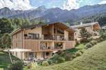 Discover the epitome of mountain living in this stunning property, boasting a modern design with natural wood accents.