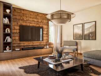 This stunning living room boasts a rustic charm with its wooden accent wall and modern furnishings.