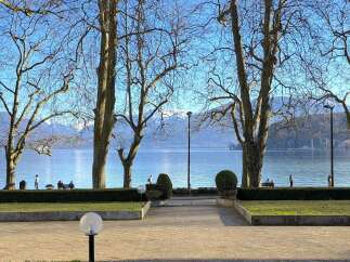Enjoy breathtaking views of the lake and mountains from this stunning property.