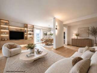 Experience modern living in this beautifully appointed living and dining area, featuring a sleek entertainment unit with integrated lighting and ample shelving.