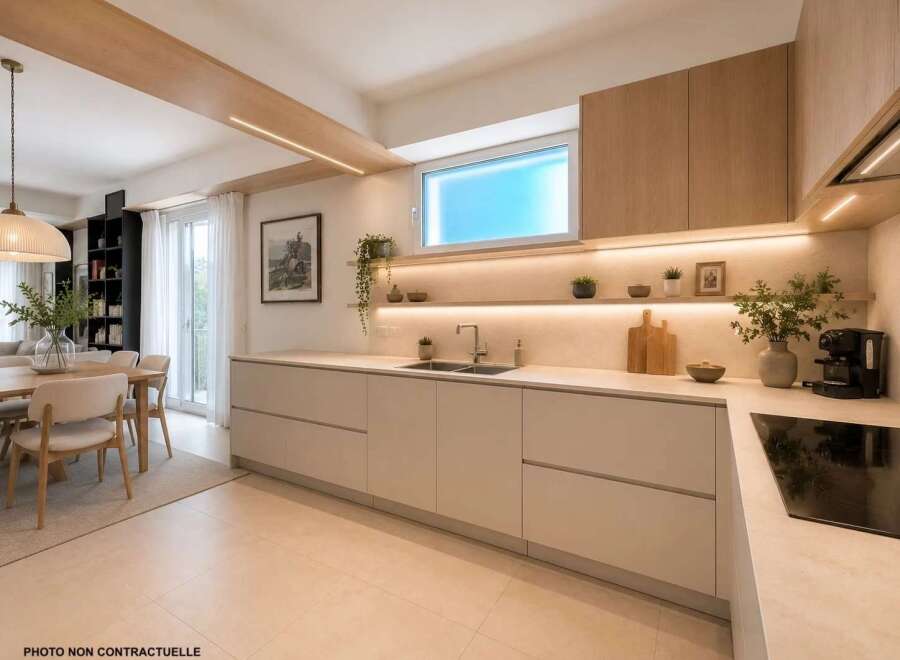 Experience modern living in this stunning kitchen featuring sleek, handleless cabinetry and integrated LED lighting for a sophisticated ambiance.