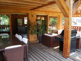 This stunning property boasts a spacious outdoor deck, perfect for entertaining guests.