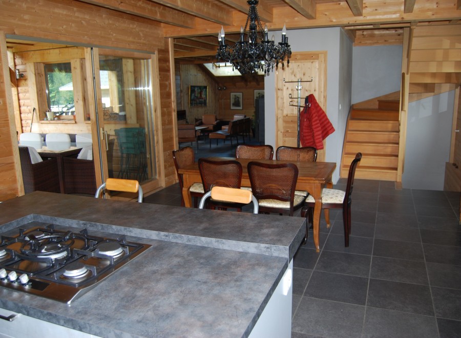 This stunning chalet boasts a spacious open-plan kitchen and dining area, perfect for entertaining guests.