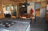 This stunning chalet boasts a spacious open-plan kitchen and dining area, perfect for entertaining guests.