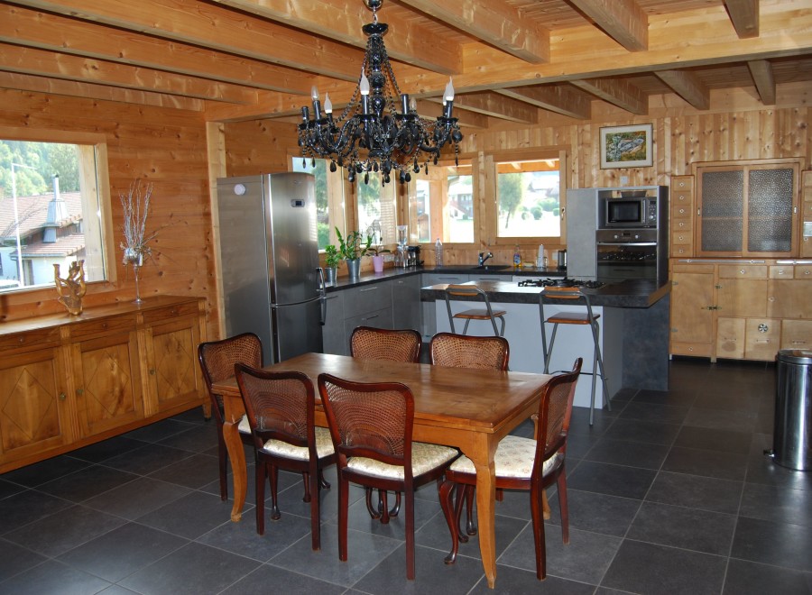 This stunning chalet boasts a spacious open-plan kitchen and dining area, perfect for entertaining.