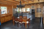 This stunning chalet boasts a spacious open-plan kitchen and dining area, perfect for entertaining.