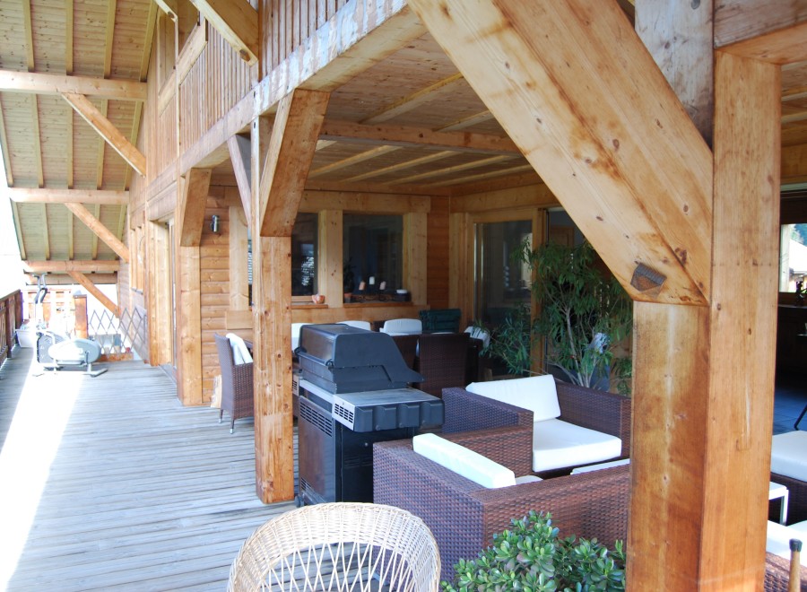 This stunning property boasts a spacious wooden deck, perfect for outdoor entertaining.