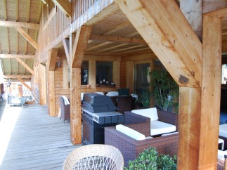 This stunning property boasts a spacious wooden deck, perfect for outdoor entertaining.