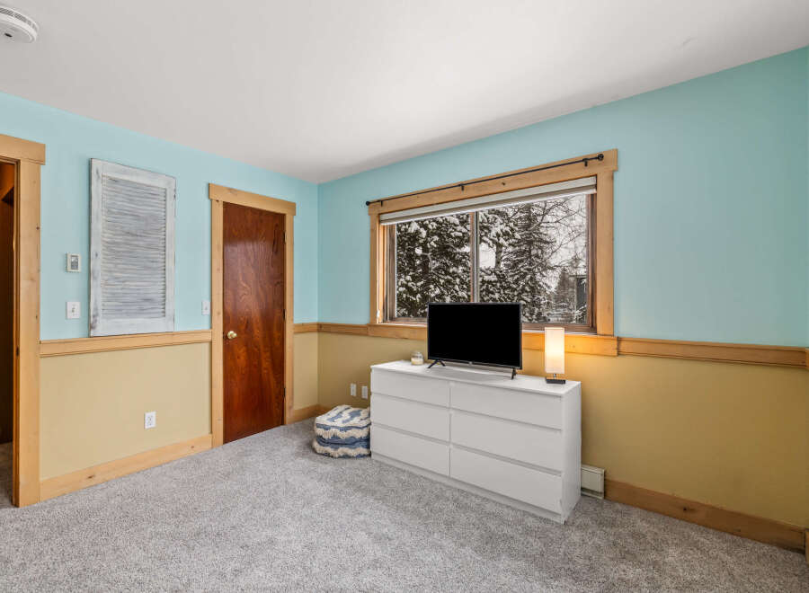 This inviting bedroom features a bright and airy atmosphere, perfect for relaxation.