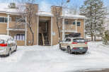 This charming property offers a cozy retreat with its snow-covered exterior and inviting atmosphere.