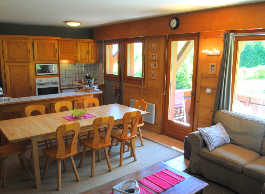This charming apartment boasts a fully equipped kitchen with wooden cabinetry, perfect for preparing meals.