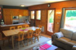 This charming apartment boasts a fully equipped kitchen with wooden cabinetry, perfect for preparing meals.