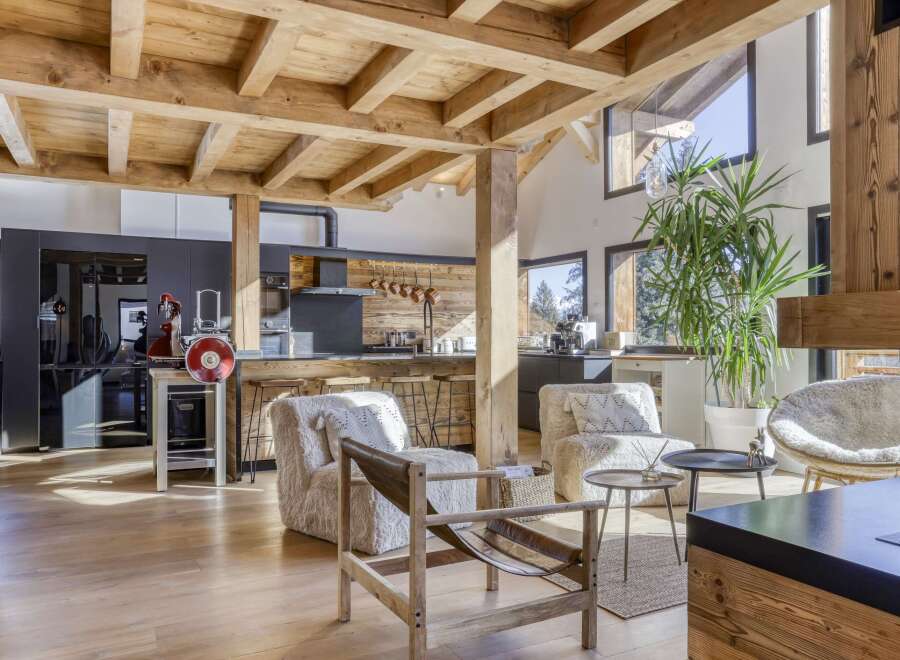 This stunning property boasts a rustic yet modern design, featuring exposed wooden beams and a spacious open-plan layout.