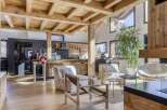 This stunning property boasts a rustic yet modern design, featuring exposed wooden beams and a spacious open-plan layout.