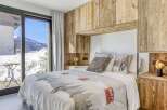 Experience the ultimate in alpine luxury with this stunning bedroom.