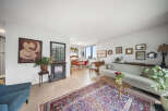 Step into this inviting living space, featuring a cozy fireplace and a stylish rug that adds warmth and character.