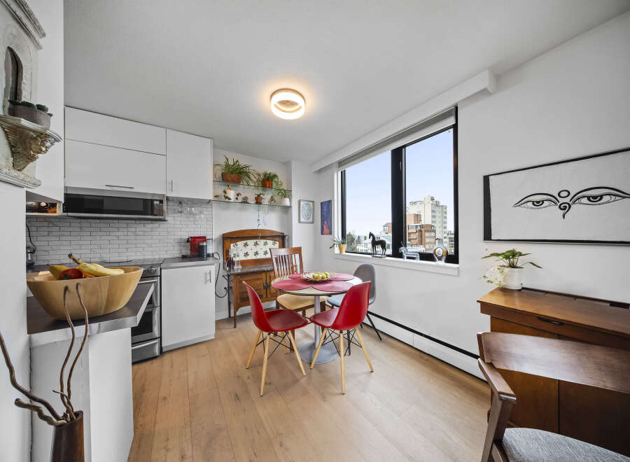 This stylish condo features a modern kitchen with stainless steel appliances and ample cabinet space.