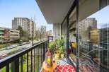 Enjoy stunning city views from this charming balcony.