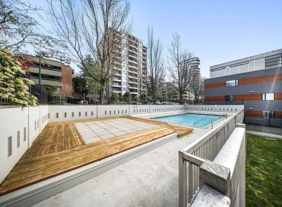 Enjoy the luxury of this stunning property with a refreshing outdoor pool, perfect for relaxation and recreation.