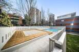 Enjoy the luxury of this stunning property with a refreshing outdoor pool, perfect for relaxation and recreation.
