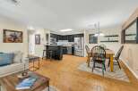Discover this stunning property featuring a modern kitchen with stainless steel appliances and sleek black cabinetry.