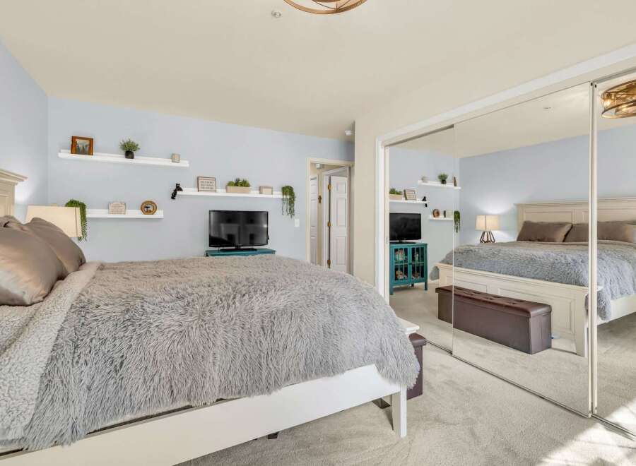 This stunning bedroom boasts a cozy and inviting atmosphere, perfect for relaxation.