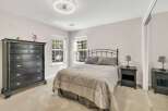 This inviting bedroom boasts a serene atmosphere, perfect for relaxation.
