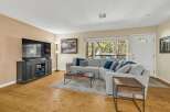 Step into this inviting living space, perfect for relaxation and entertaining.