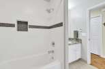 Step into a beautifully designed bathroom featuring a modern shower with a sleek design.