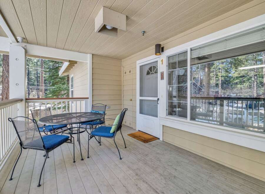 Enjoy the tranquility of this charming property with a welcoming porch.