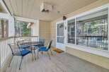 Enjoy the tranquility of this charming property with a welcoming porch.