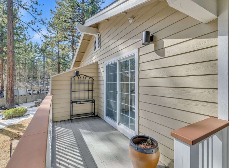 Enjoy the serene beauty of this property, featuring a charming balcony with a sliding glass door.