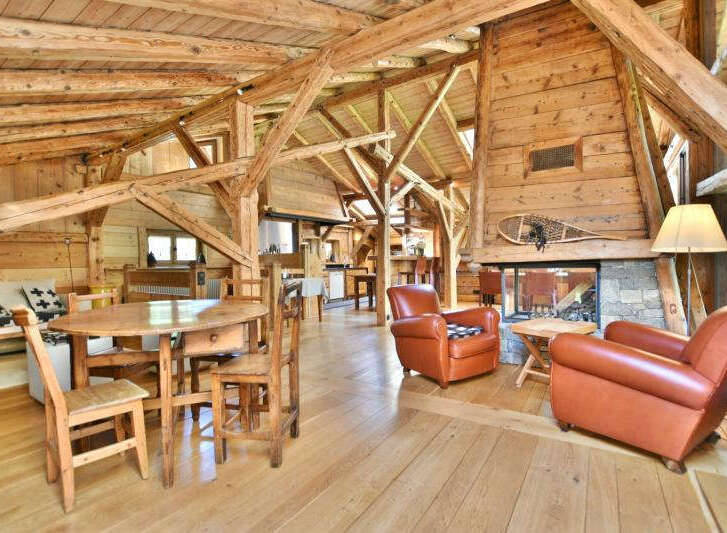 Step into rustic elegance with this stunning property featuring exposed wooden beams and a cozy fireplace.