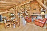 Step into rustic elegance with this stunning property featuring exposed wooden beams and a cozy fireplace.
