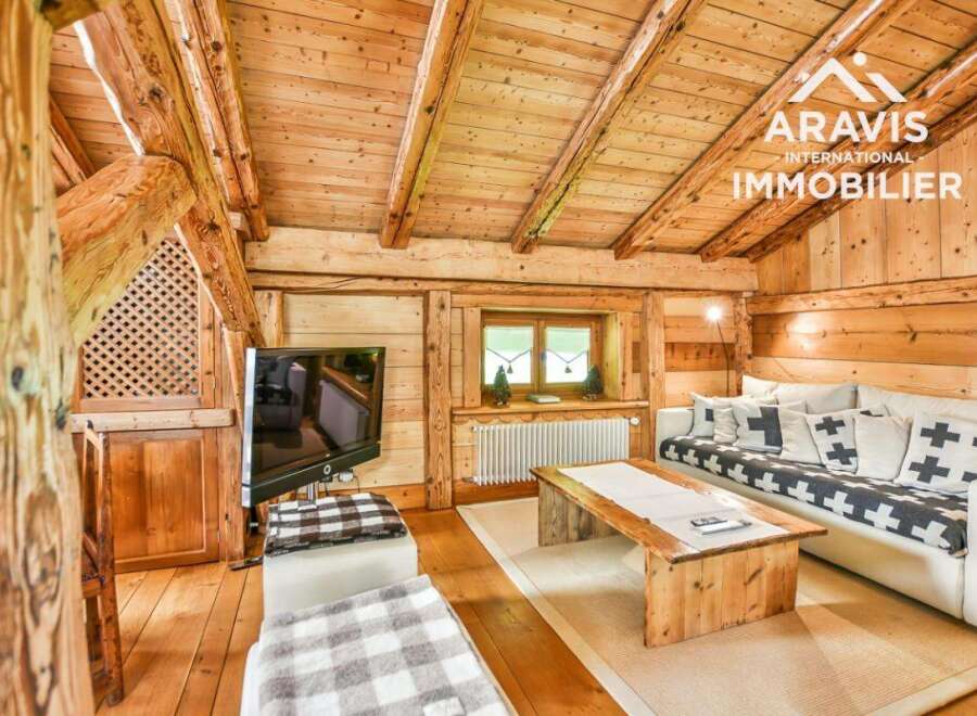Discover the charm of this stunning property, featuring a cozy living space with exposed wooden beams and a warm, inviting atmosphere.