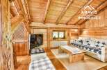 Discover the charm of this stunning property, featuring a cozy living space with exposed wooden beams and a warm, inviting atmosphere.