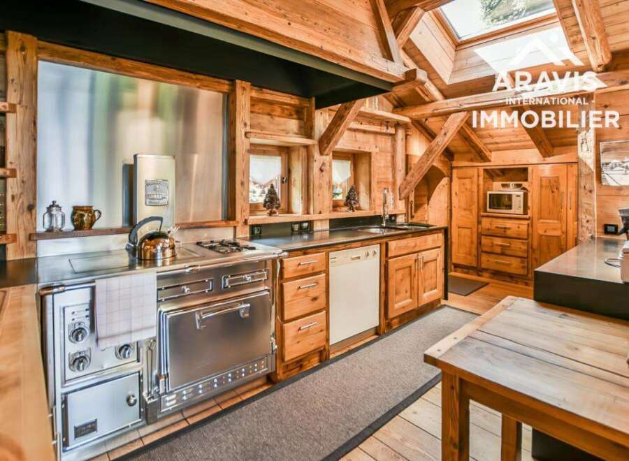 Step into rustic elegance with this stunning kitchen! Featuring a stainless steel stove, wooden cabinets, and a charming wooden interior, this space is perfect for cooking and entertaining.