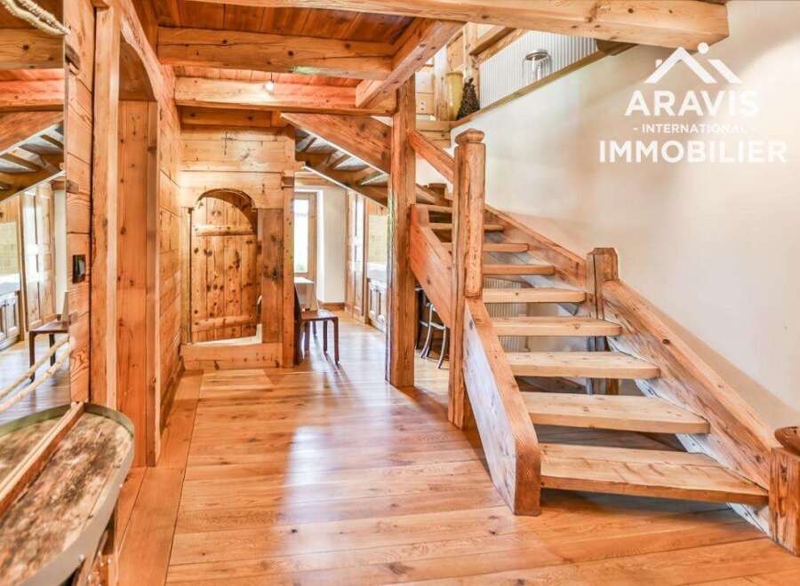 Step into rustic elegance with this stunning property, showcasing exquisite wooden craftsmanship throughout.